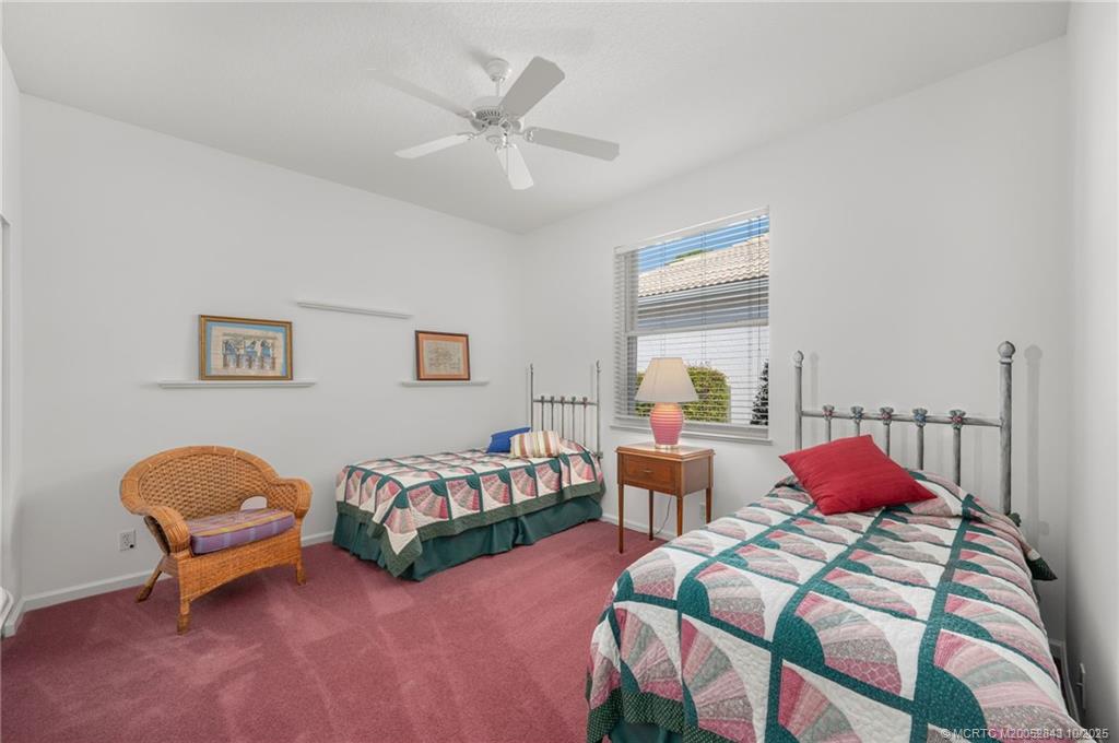 2227 Southeast Stonehaven Road Port St. Lucie, FL 34952 - Photo 27 of 35 a bedroom with two beds and a window