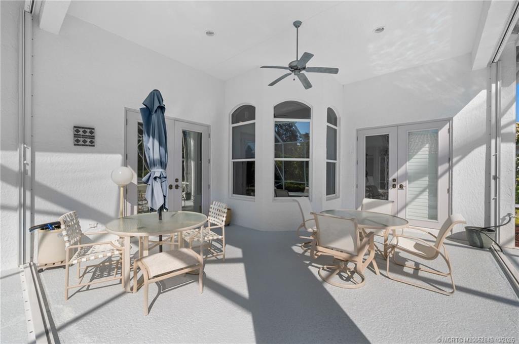 2227 Southeast Stonehaven Road Port St. Lucie, FL 34952 - Photo 28 of 35 a view of a livingroom with furniture and floor to ceiling window