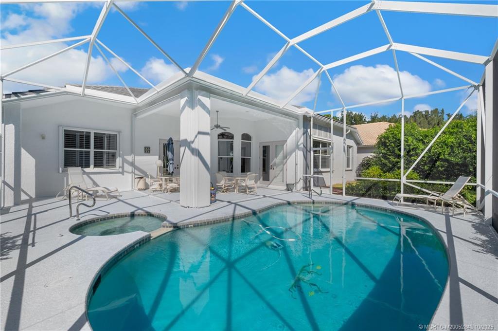 2227 Southeast Stonehaven Road Port St. Lucie, FL 34952 - Photo 30 of 35 a view of swimming pool with outdoor seating and a yard