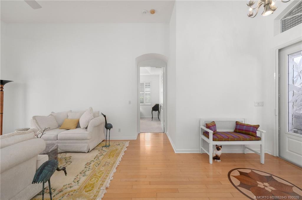 2227 Southeast Stonehaven Road Port St. Lucie, FL 34952 - Photo 5 of 35 a living room with furniture and a table