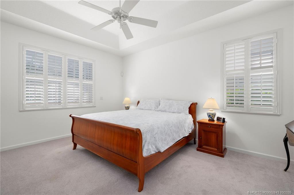 2227 Southeast Stonehaven Road Port St. Lucie, FL 34952 - Photo 6 of 35 a bedroom with a bed and window