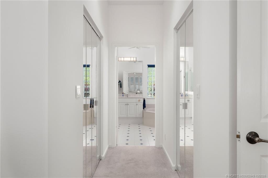 2227 Southeast Stonehaven Road Port St. Lucie, FL 34952 - Photo 8 of 35 a bathroom with a glass shower door