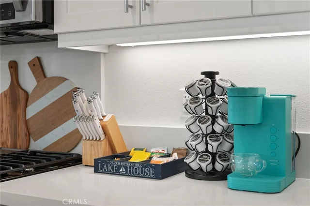 a kitchen with a refrigerator and cabinets