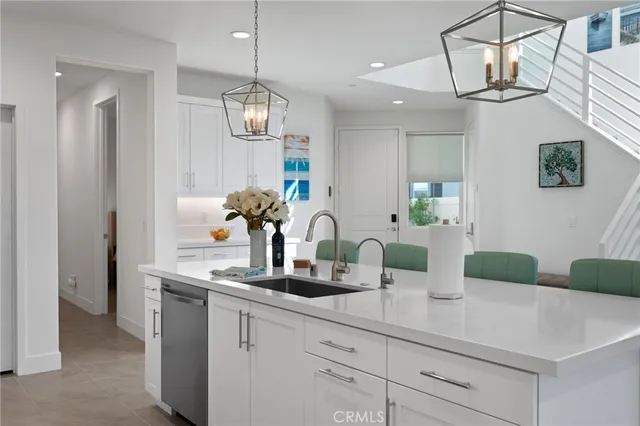 a living room with furniture a flat screen tv and a large window
