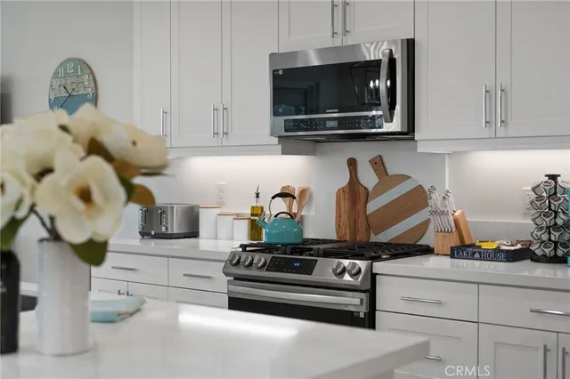 a bathroom with a granite countertop sink a toilet and a mirror