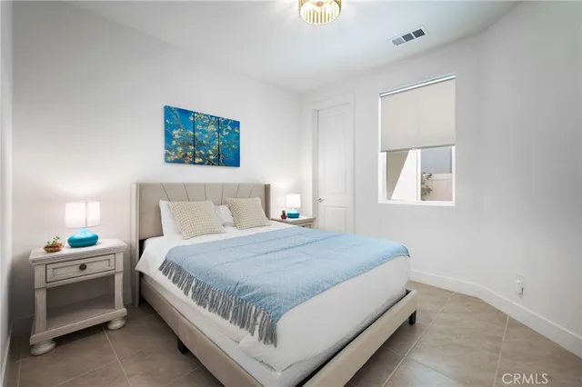 a bathroom with a granite countertop sink mirror vanity and toilet
