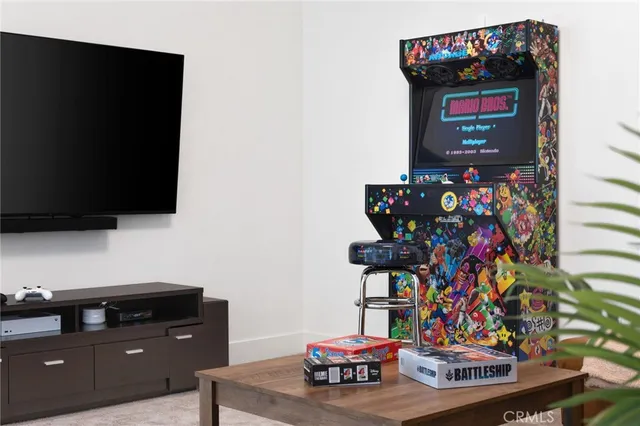 a bedroom with bed and a chandelier