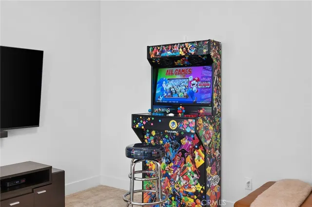 a spacious bedroom with a bed a couch and a window