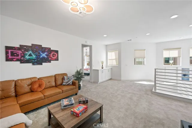 a bedroom with a bed and a wall painting