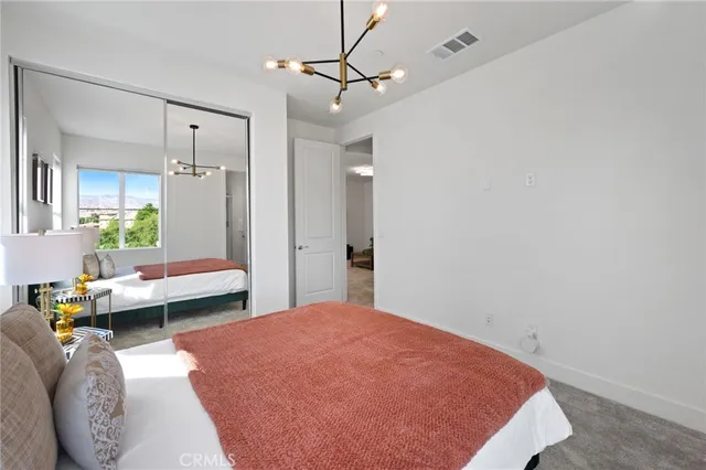 a view of a balcony with two chairs and a fire pit