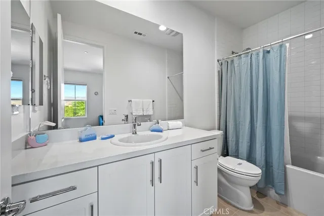 a view of a patio with couches chairs and potted plants