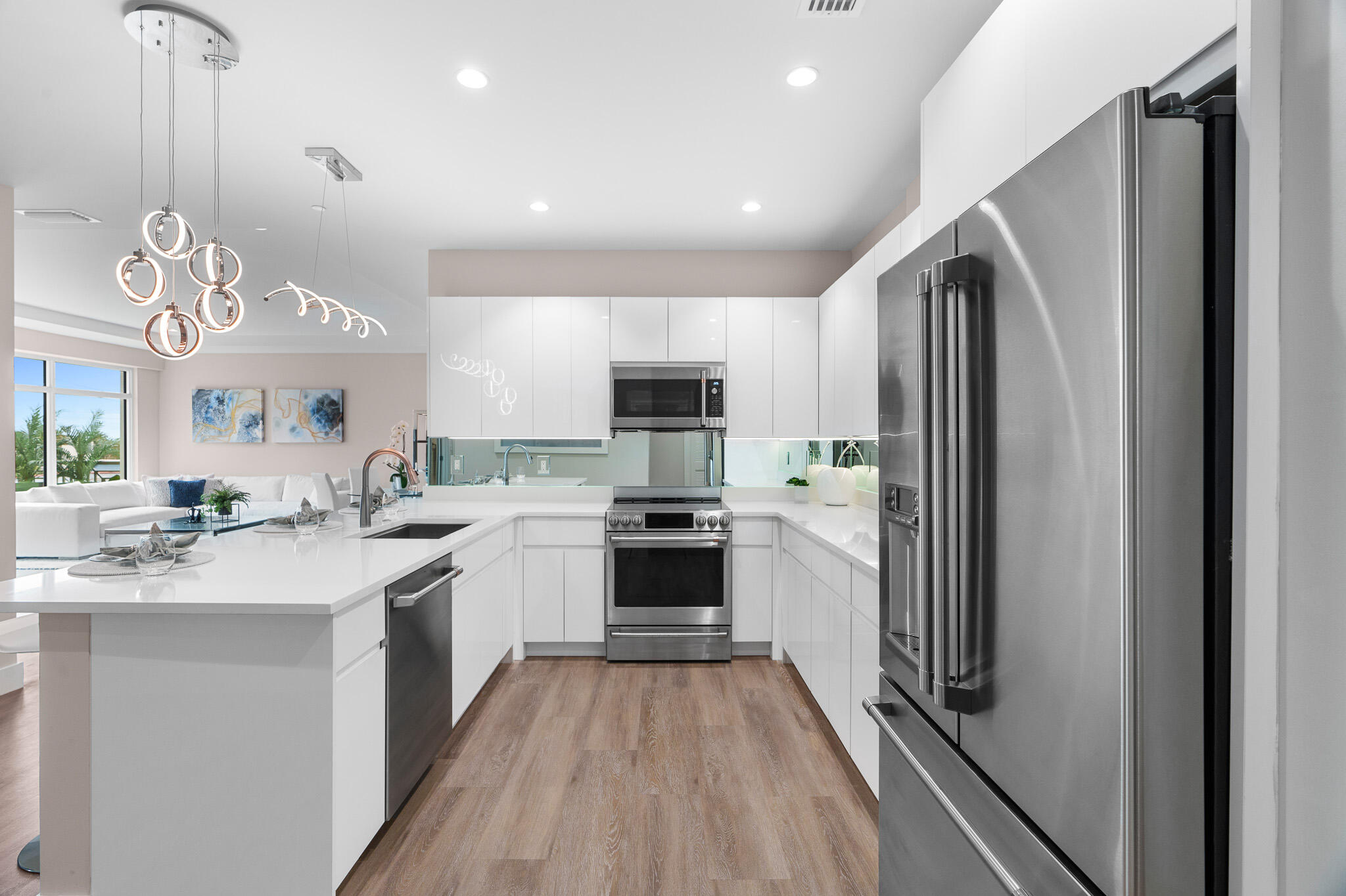 41 Southwest Seminole Street, Unit 310 Stuart, FL 34994 - Photo 18 of 55 a kitchen with a sink stainless steel appliances and cabinets