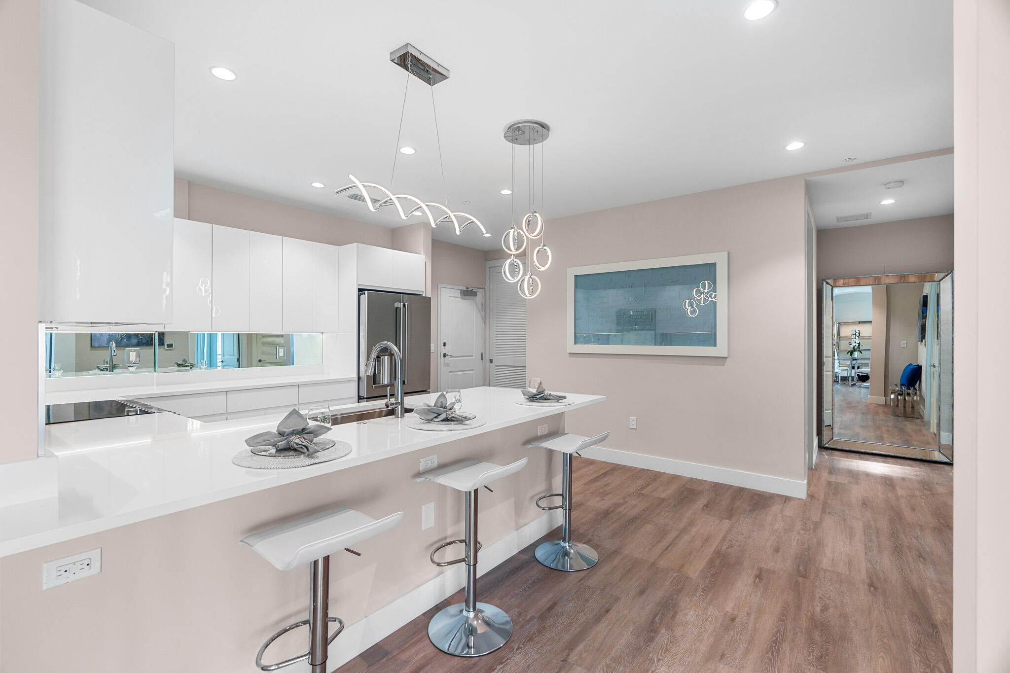 41 Southwest Seminole Street, Unit 310 Stuart, FL 34994 - Photo 2 of 55 a spacious bathroom with a granite countertop sink a mirror and shower