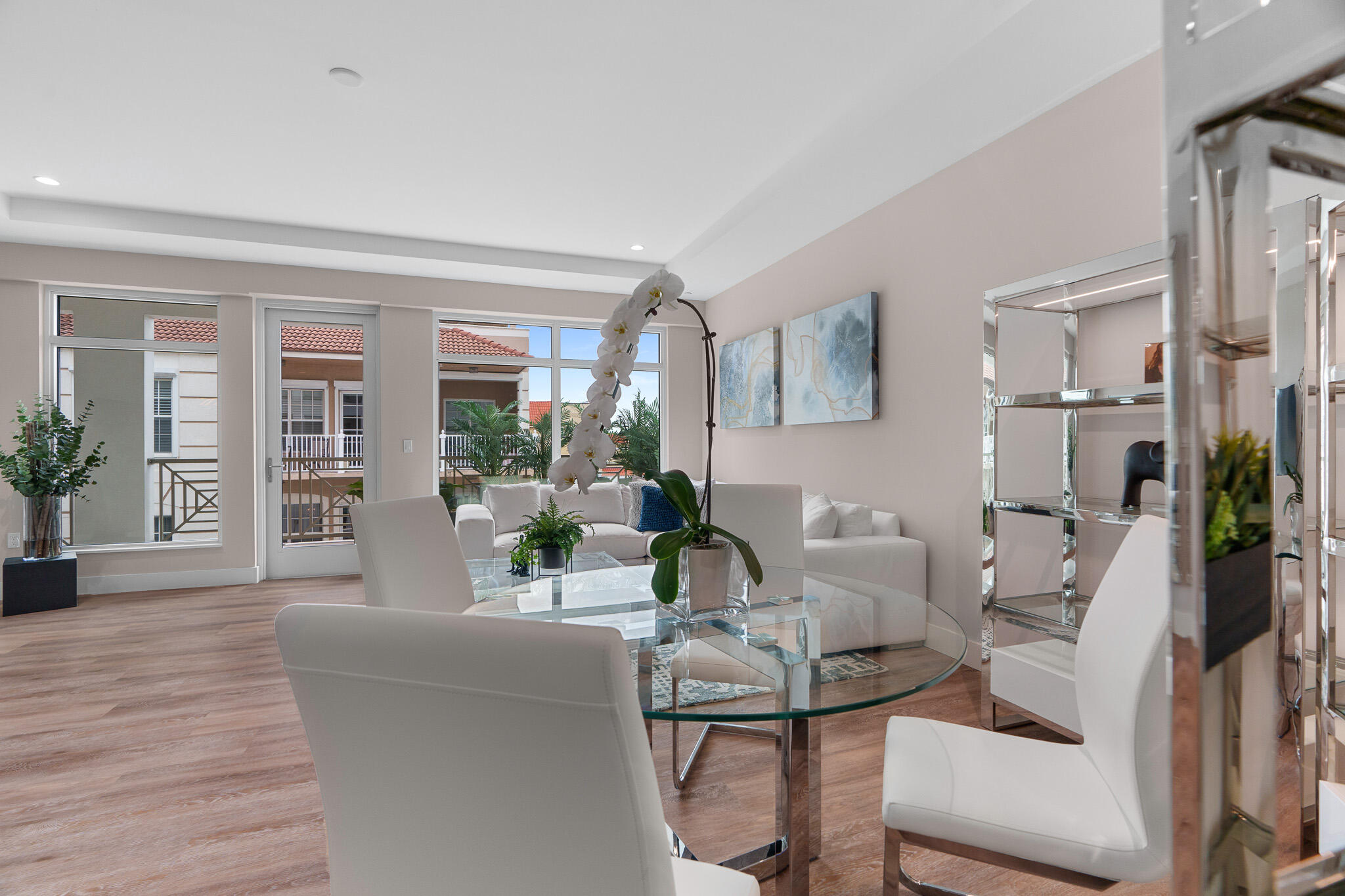 41 Southwest Seminole Street, Unit 310 Stuart, FL 34994 - Photo 8 of 55 a living room with furniture and potted plants