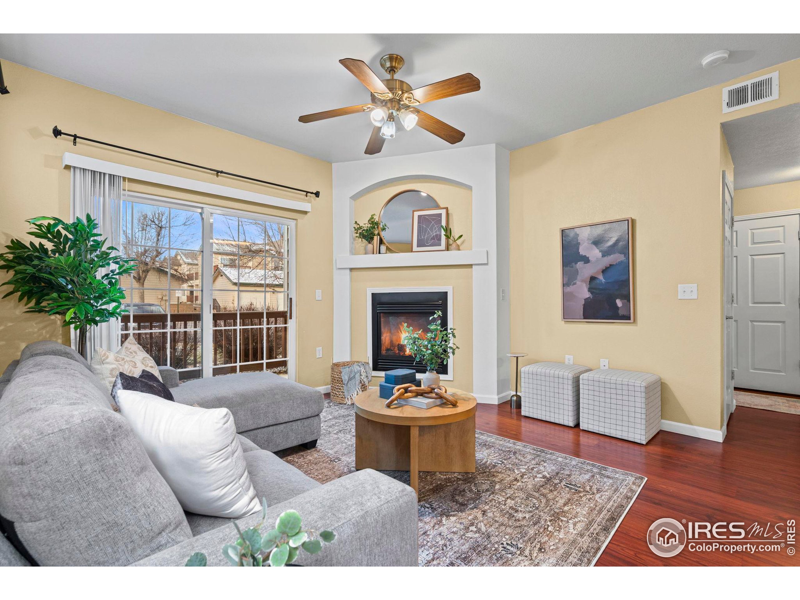 3002 West Elizabeth Street, Unit D Fort Collins, CO 80521 - Photo 5 of 23 a living room with furniture a window and a fireplace