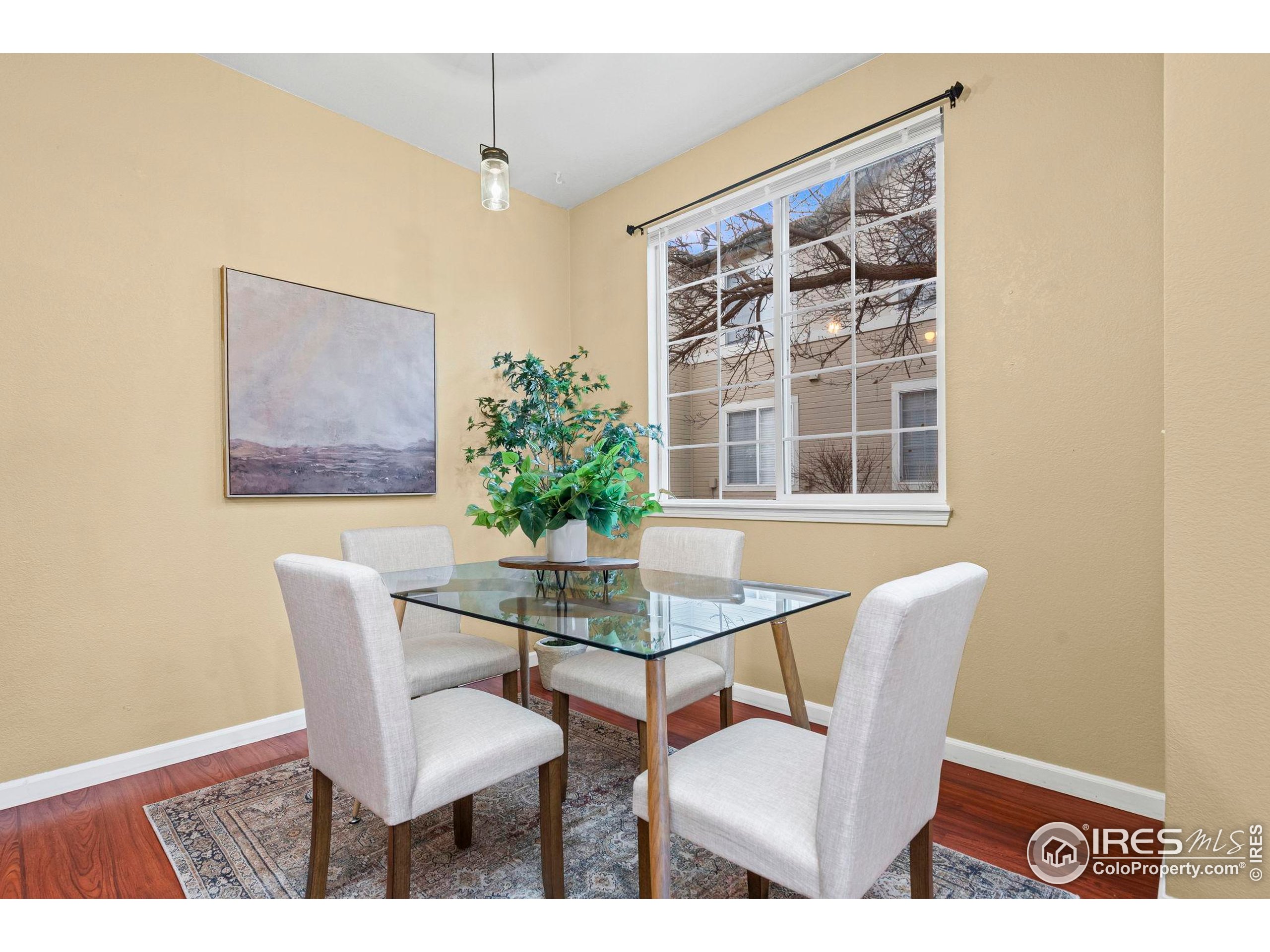 3002 West Elizabeth Street, Unit D Fort Collins, CO 80521 - Photo 8 of 23 a dining room with furniture and window