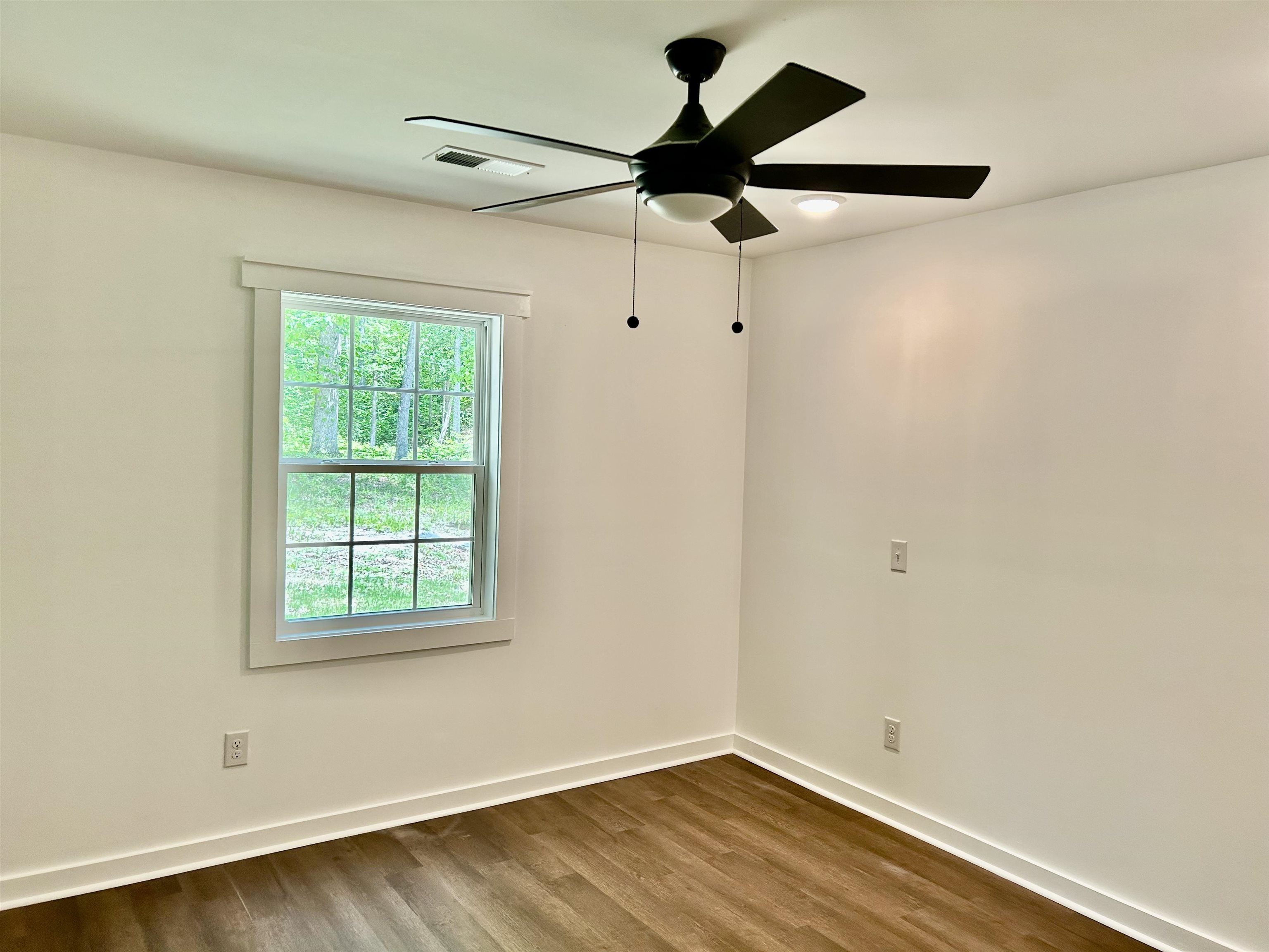 35 Grapevine Cove Counce, TN 38326 - Photo 12 of 25 an empty room with a window and a fan