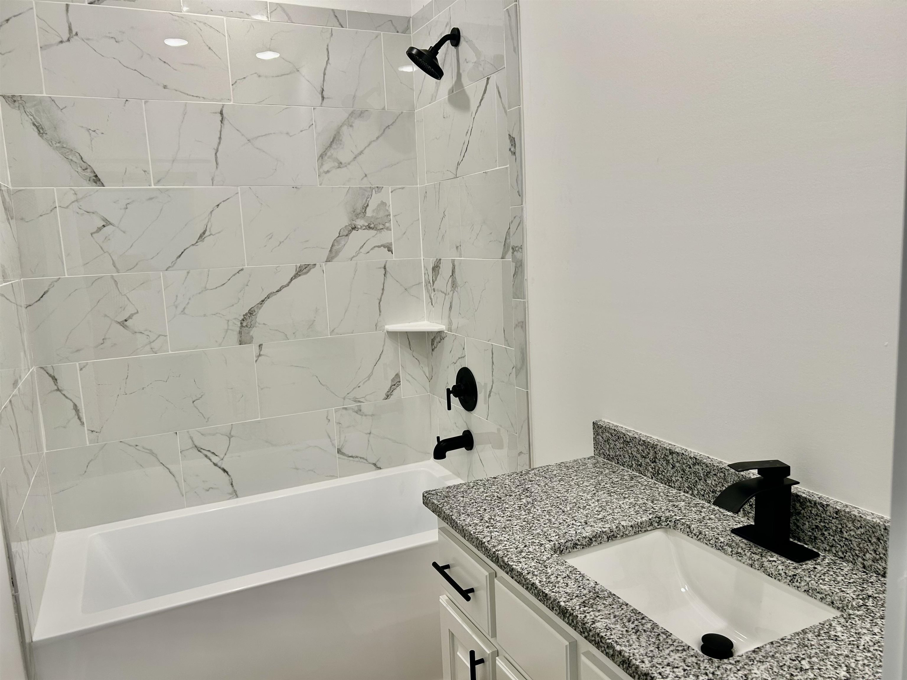 35 Grapevine Cove Counce, TN 38326 - Photo 13 of 25 a bathroom with a granite countertop sink a toilet and bathtub