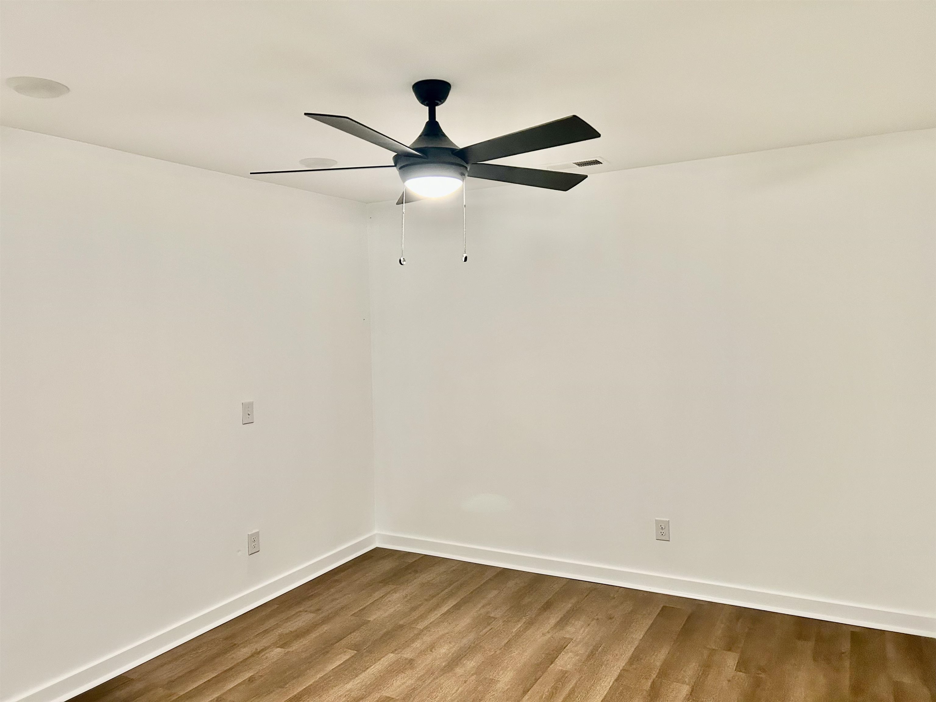 35 Grapevine Cove Counce, TN 38326 - Photo 16 of 25 an empty room with a ceiling fan and carpet