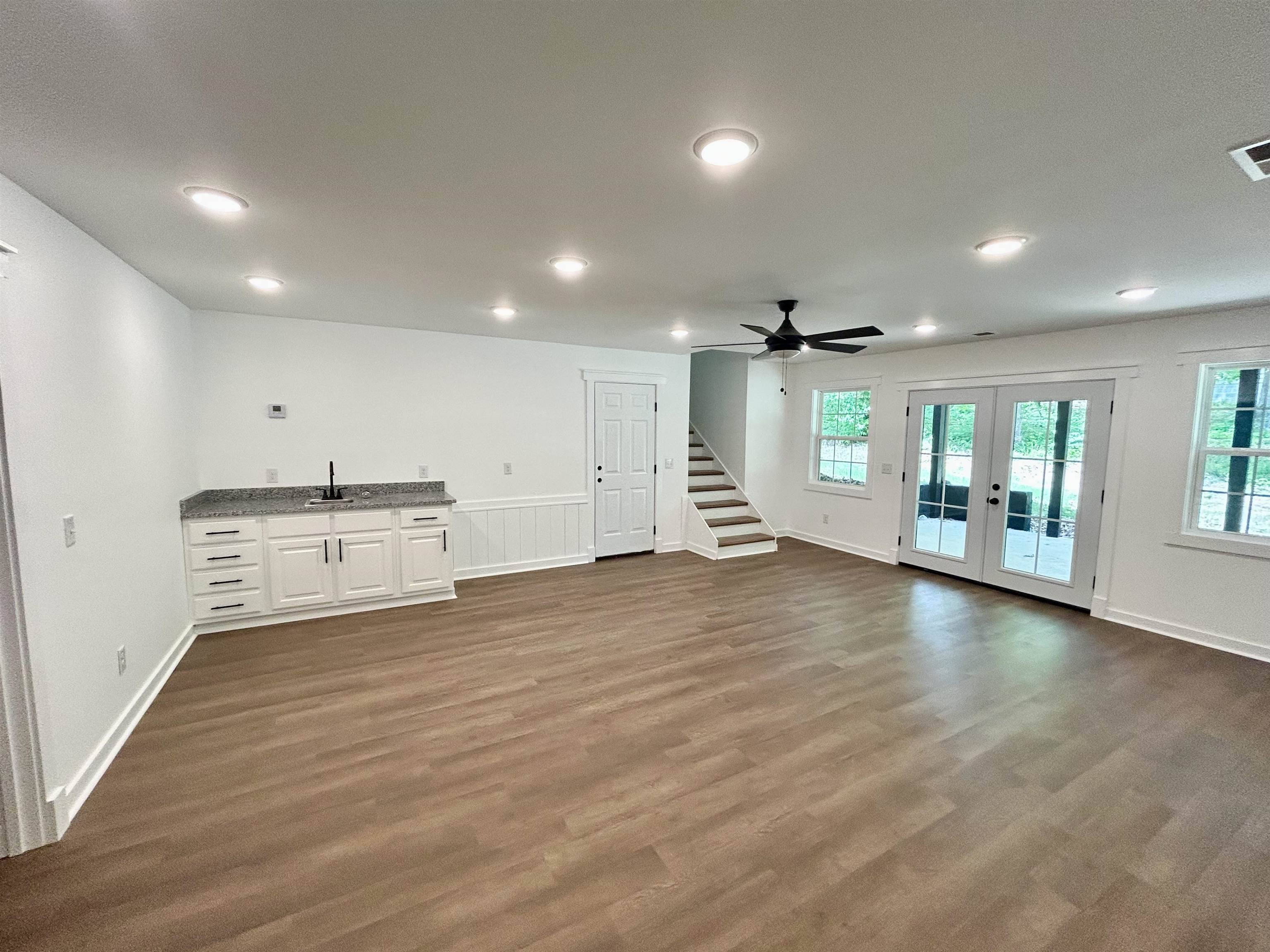 35 Grapevine Cove Counce, TN 38326 - Photo 19 of 25 an empty room with wooden floor and windows