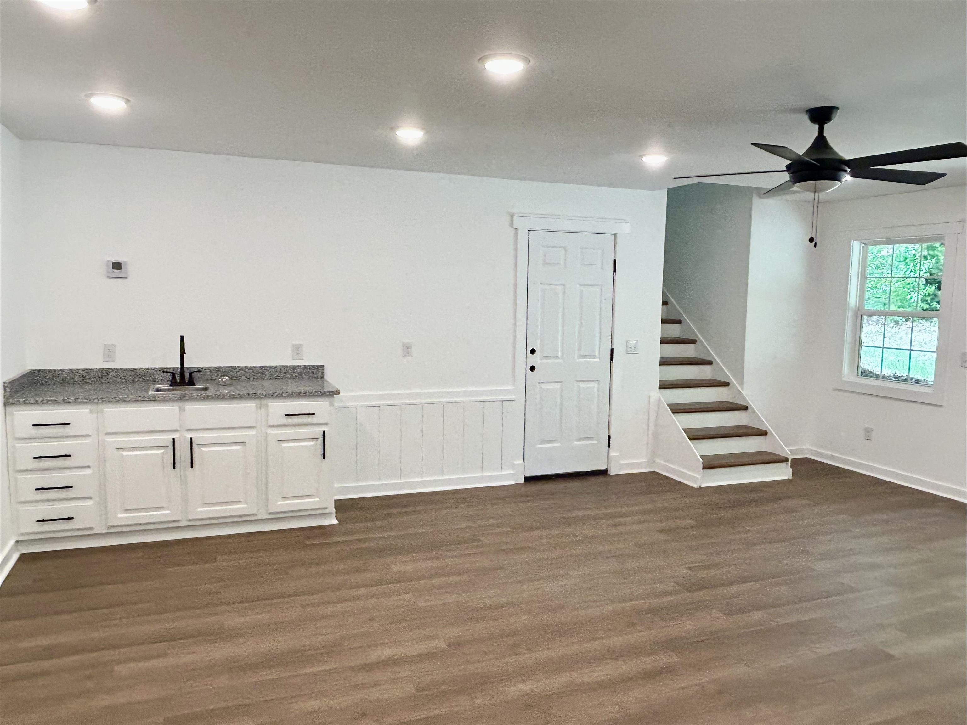 35 Grapevine Cove Counce, TN 38326 - Photo 20 of 25 a view of an empty room with a window and wooden floor