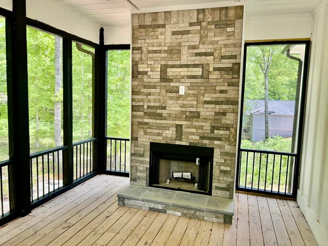 a view of livingroom with wooden floor and fireplace