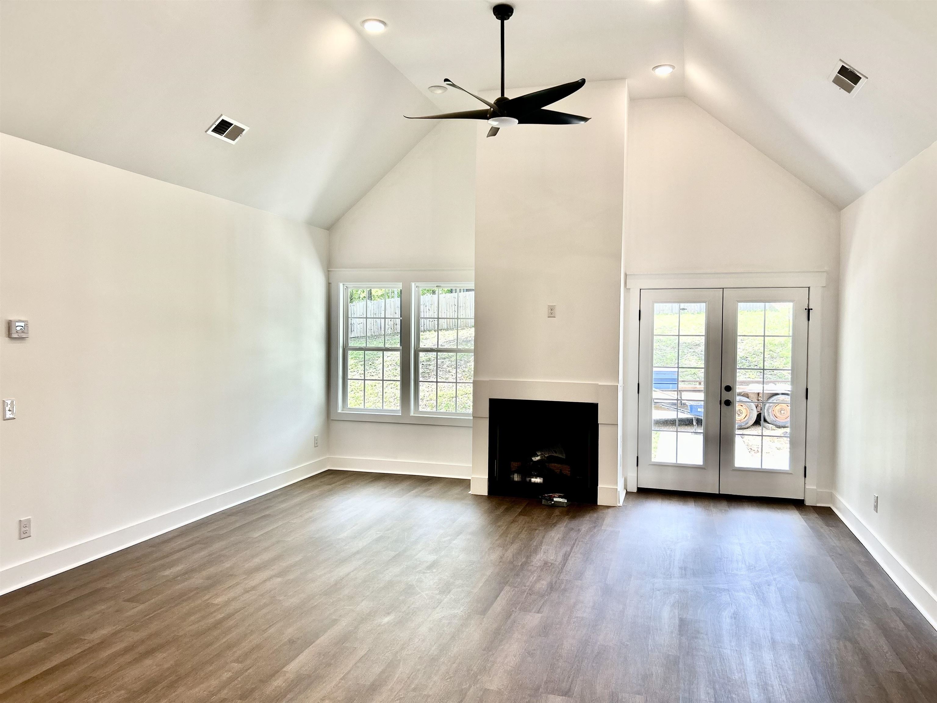 35 Grapevine Cove Counce, TN 38326 - Photo 3 of 25 a view of empty room with a fireplace and wooden floor