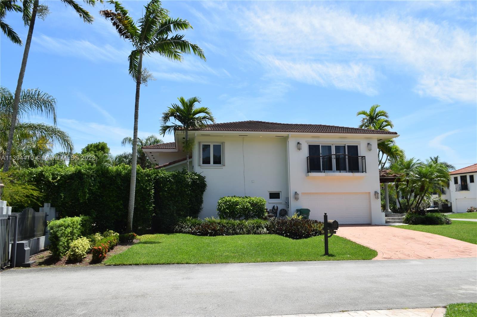 7115 Southwest 69th Court Miami, FL 33143 - Photo 12 of 58 a front view of a house with a garden