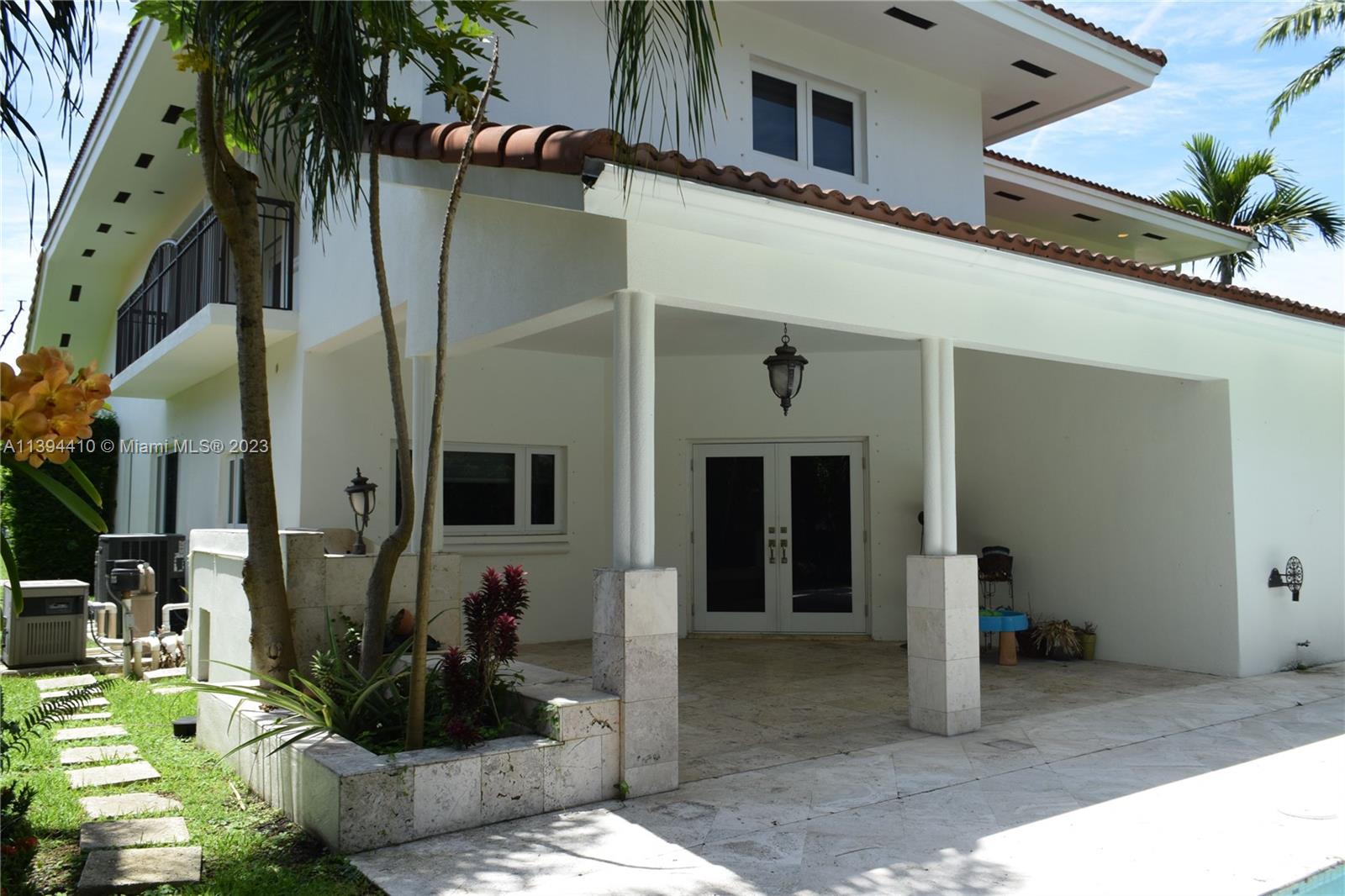 7115 Southwest 69th Court Miami, FL 33143 - Photo 15 of 58 a front view of a house with garden