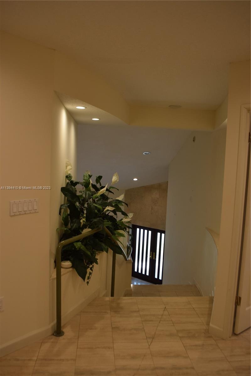 7115 Southwest 69th Court Miami, FL 33143 - Photo 20 of 58 a view of a porch with a dining table and chairs