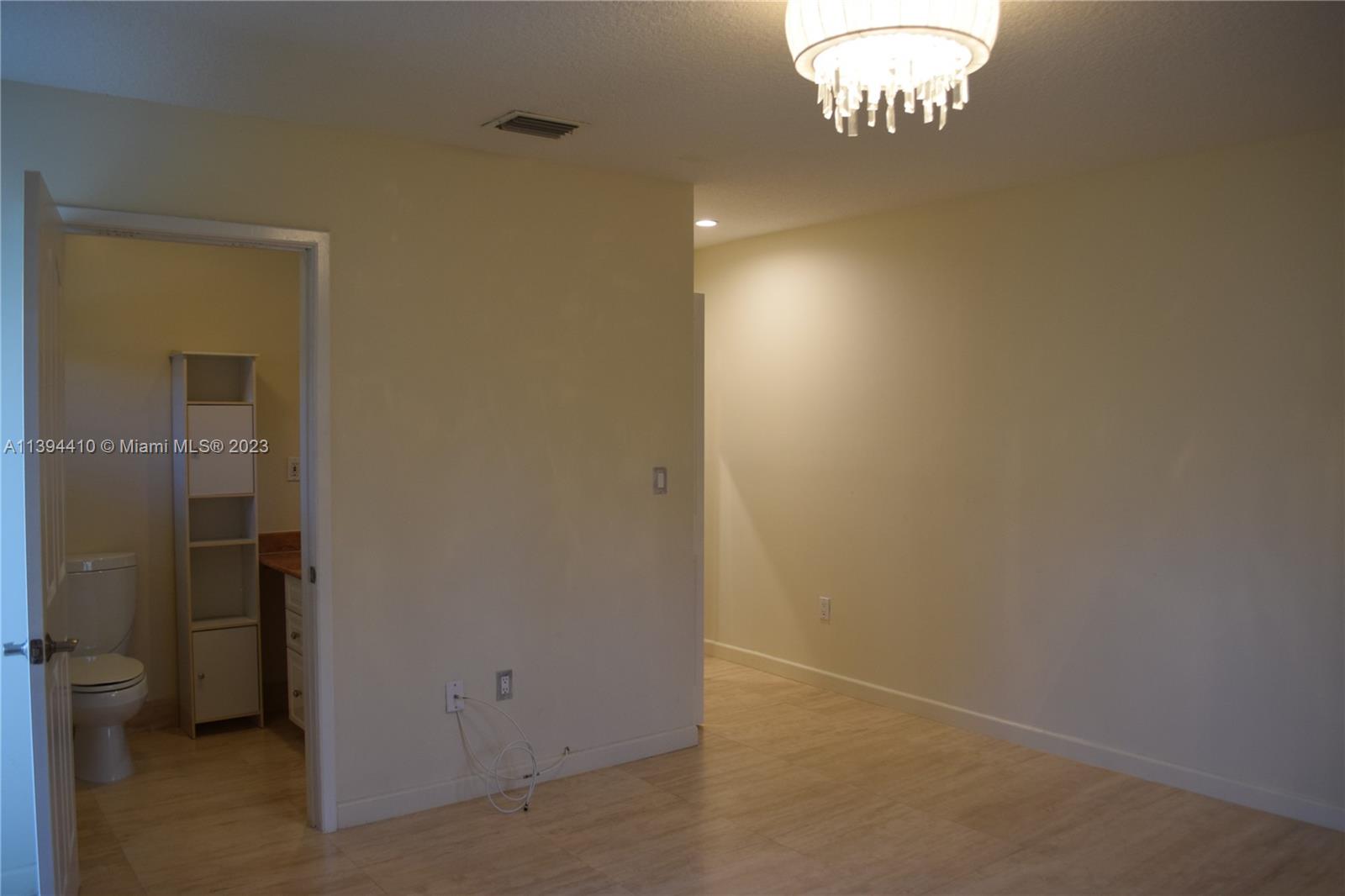 7115 Southwest 69th Court Miami, FL 33143 - Photo 36 of 58 wooden floor in an empty room