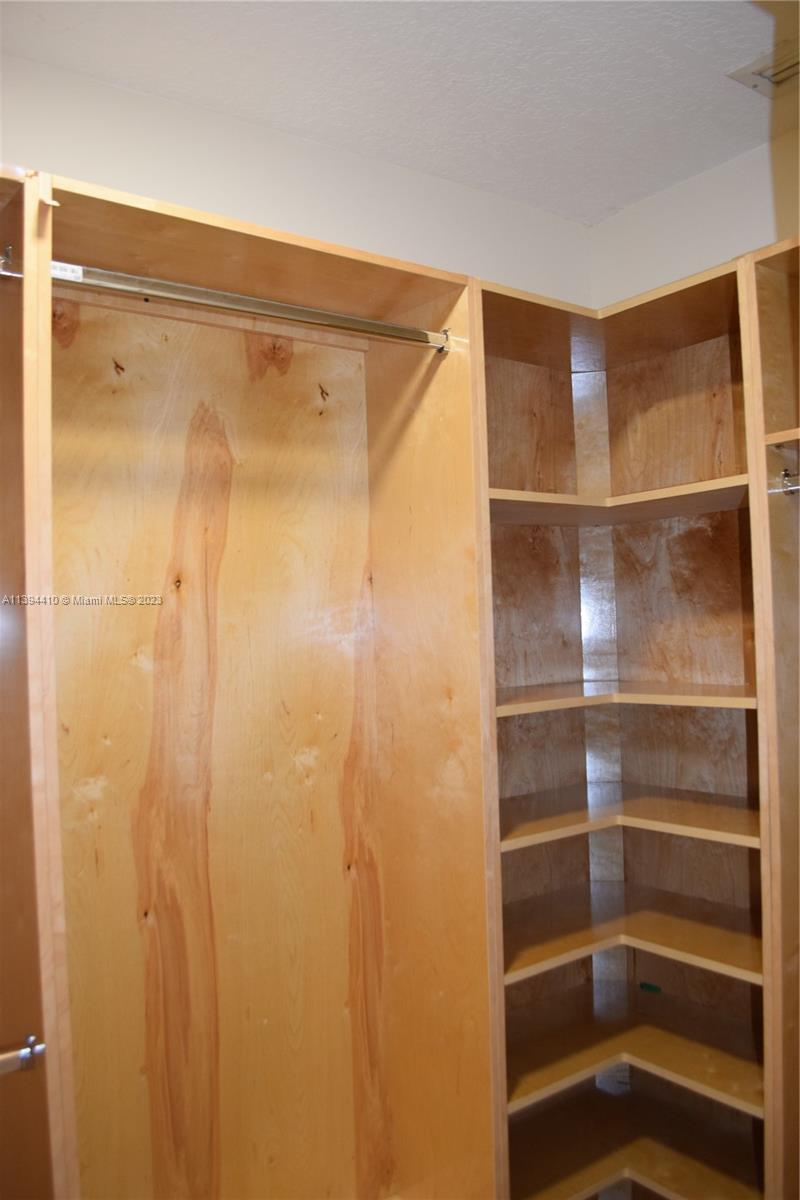 7115 Southwest 69th Court Miami, FL 33143 - Photo 37 of 58 a bathroom with a shower and a glass door