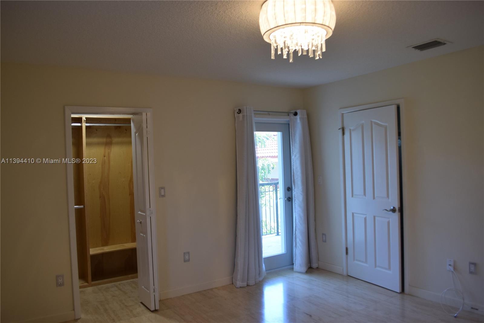 7115 Southwest 69th Court Miami, FL 33143 - Photo 38 of 58 an view of a hallway with wooden floor