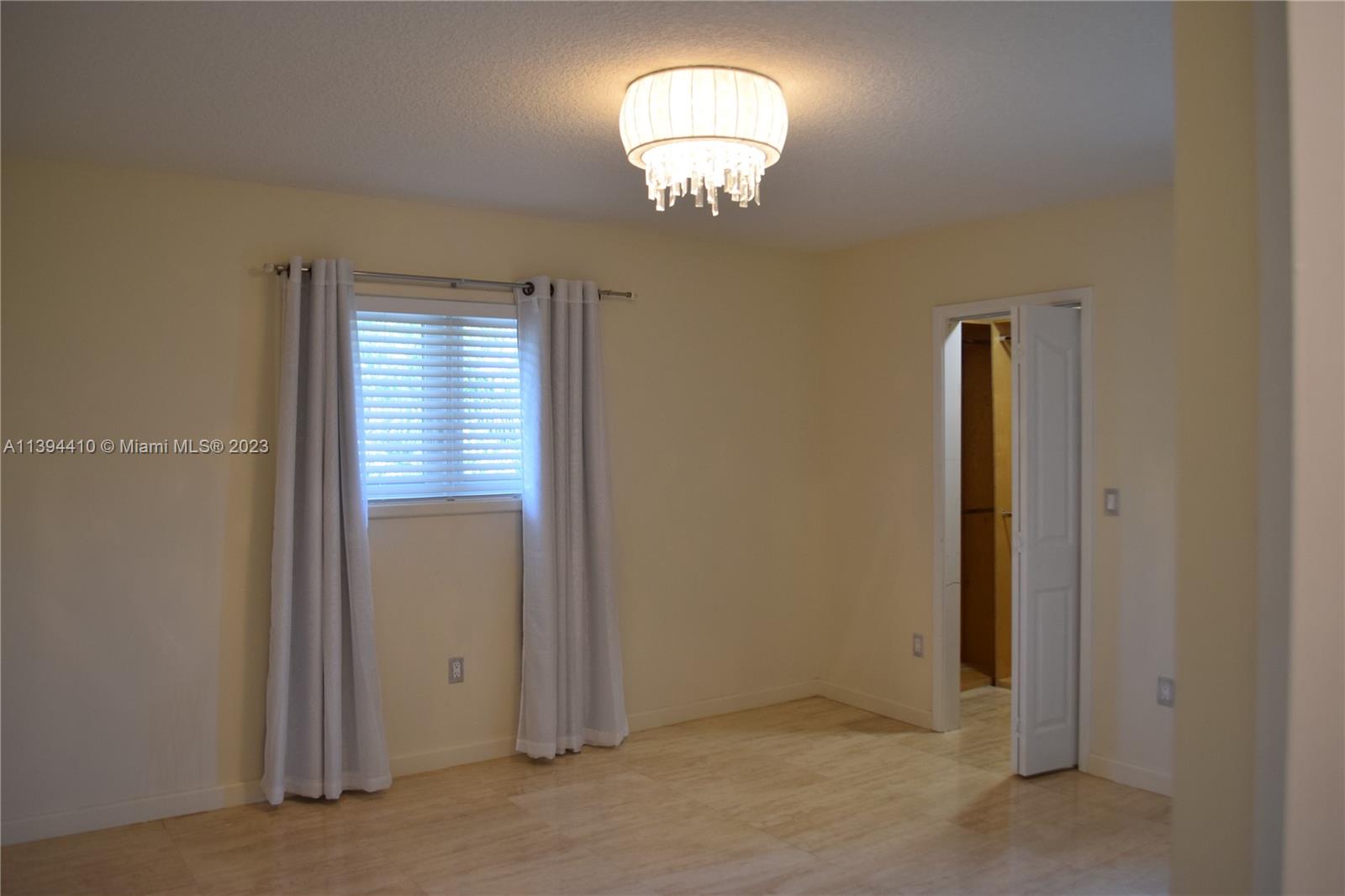 7115 Southwest 69th Court Miami, FL 33143 - Photo 39 of 58 an empty room with a mirror