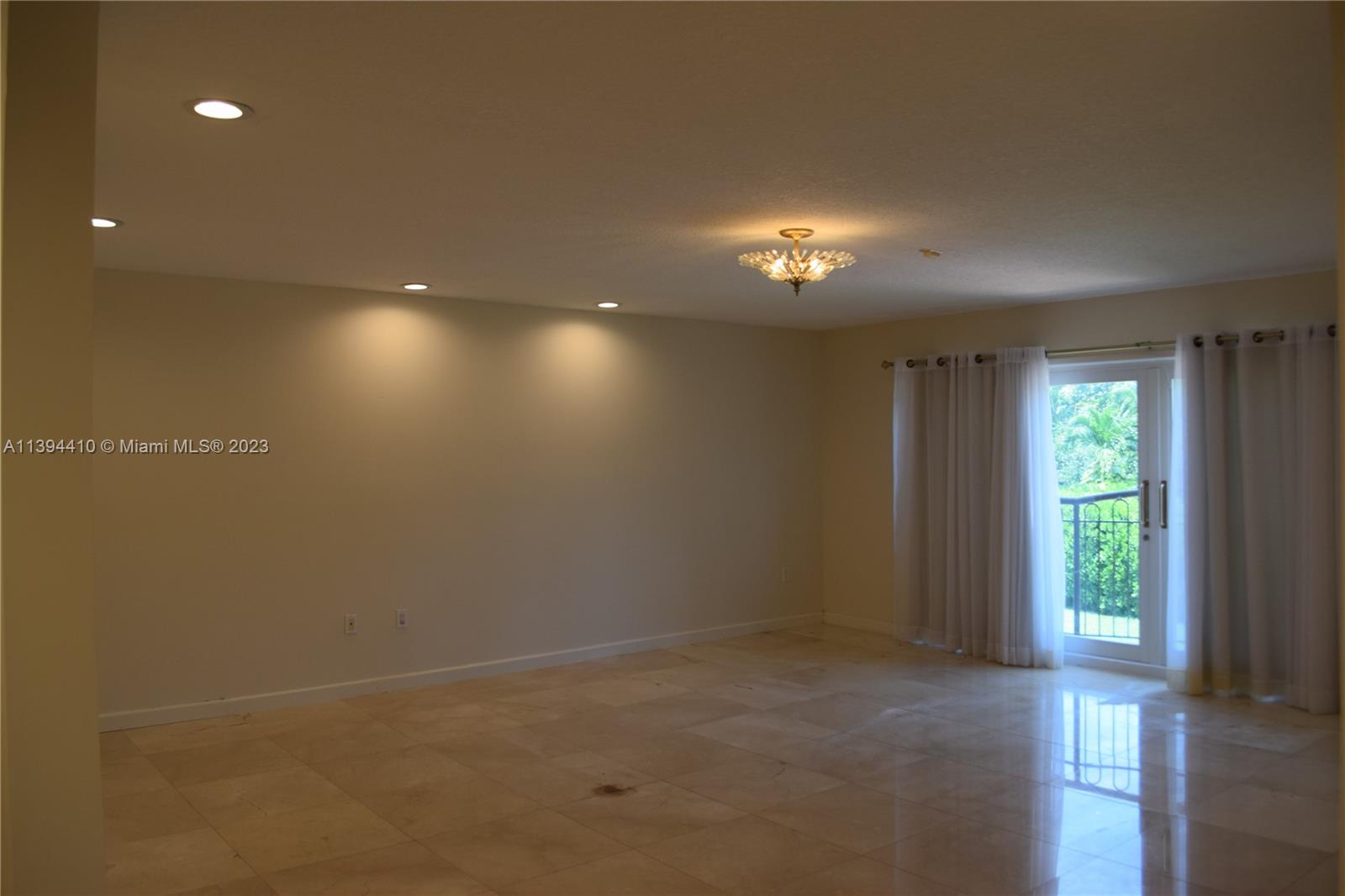 7115 Southwest 69th Court Miami, FL 33143 - Photo 42 of 58 a view of an empty room with a window