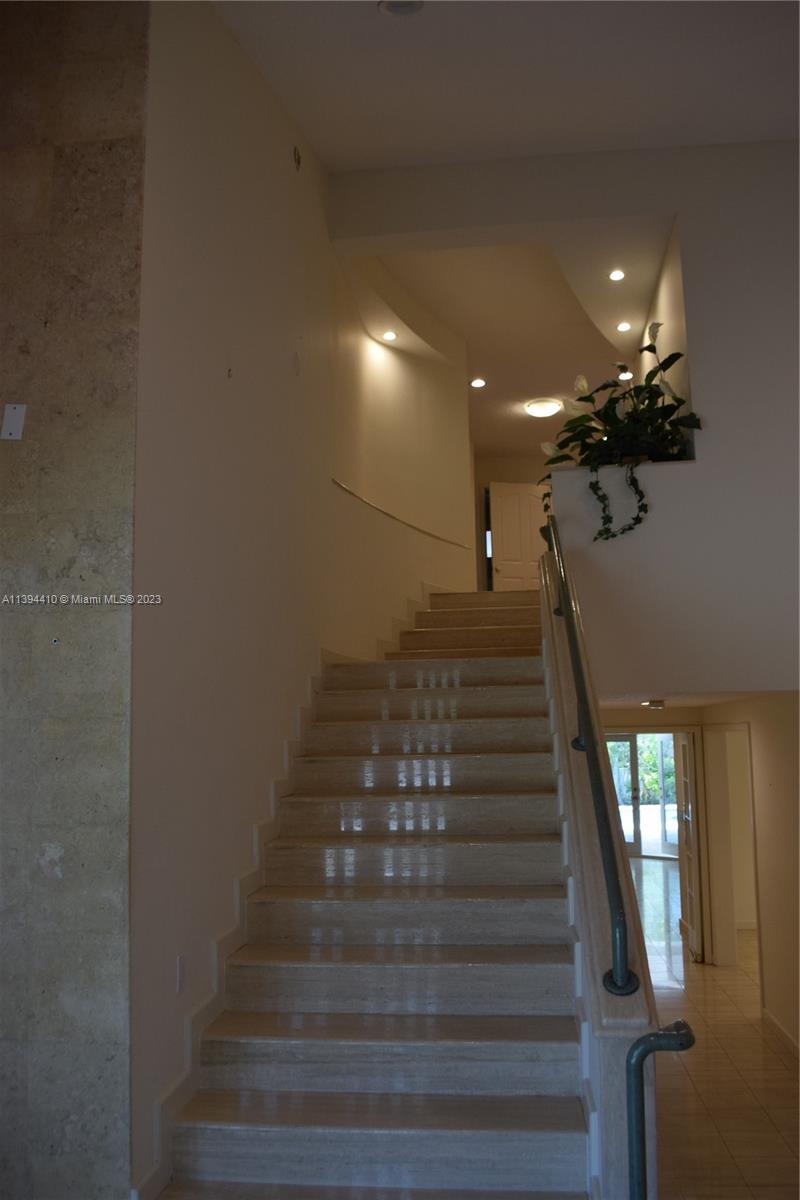 7115 Southwest 69th Court Miami, FL 33143 - Photo 43 of 58 a view of entryway and hall with wooden floor