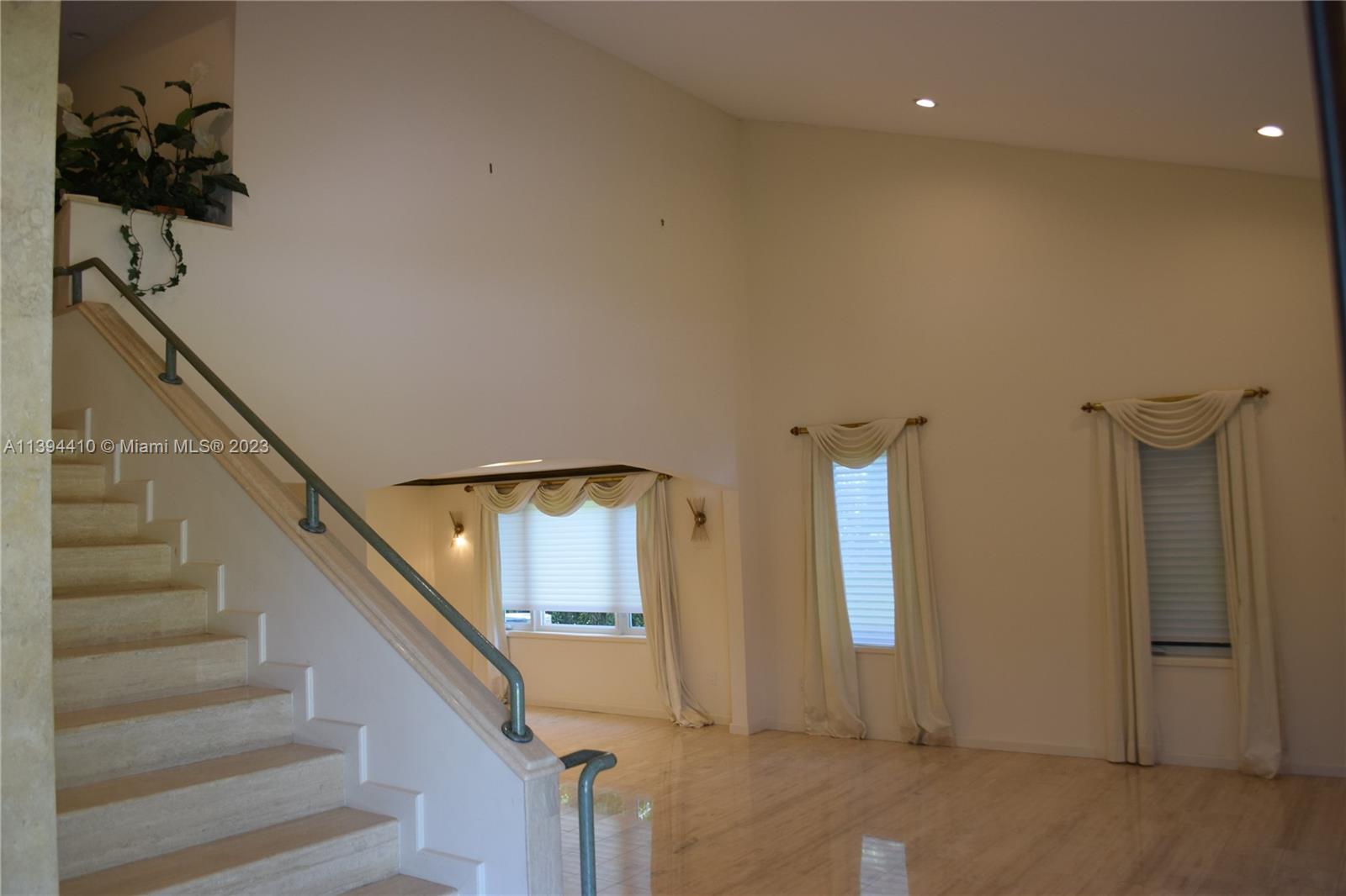 7115 Southwest 69th Court Miami, FL 33143 - Photo 49 of 58 a view of entryway and hall with wooden floor