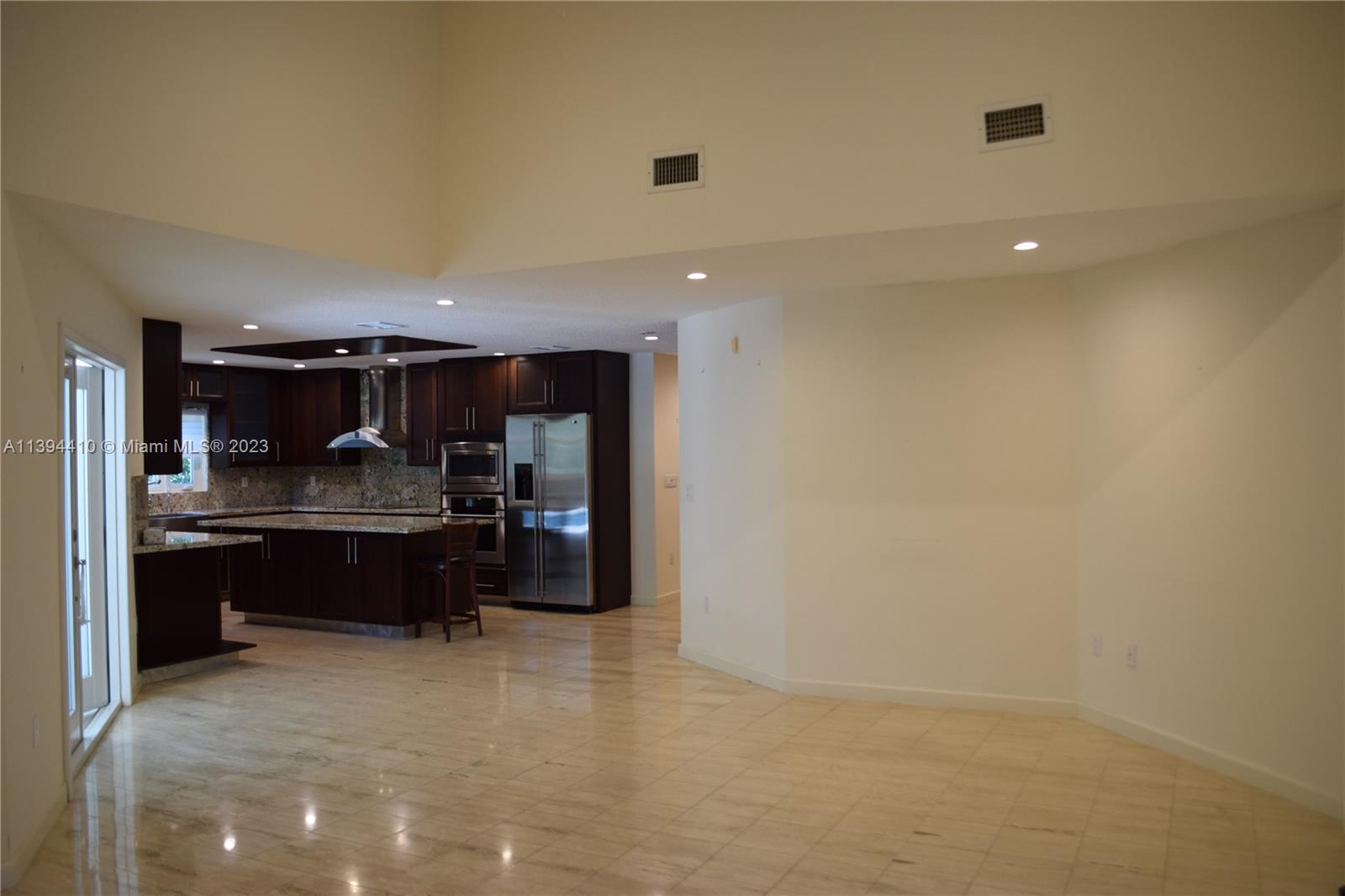 7115 Southwest 69th Court Miami, FL 33143 - Photo 51 of 58 a kitchen with stainless steel appliances a refrigerator and a sink