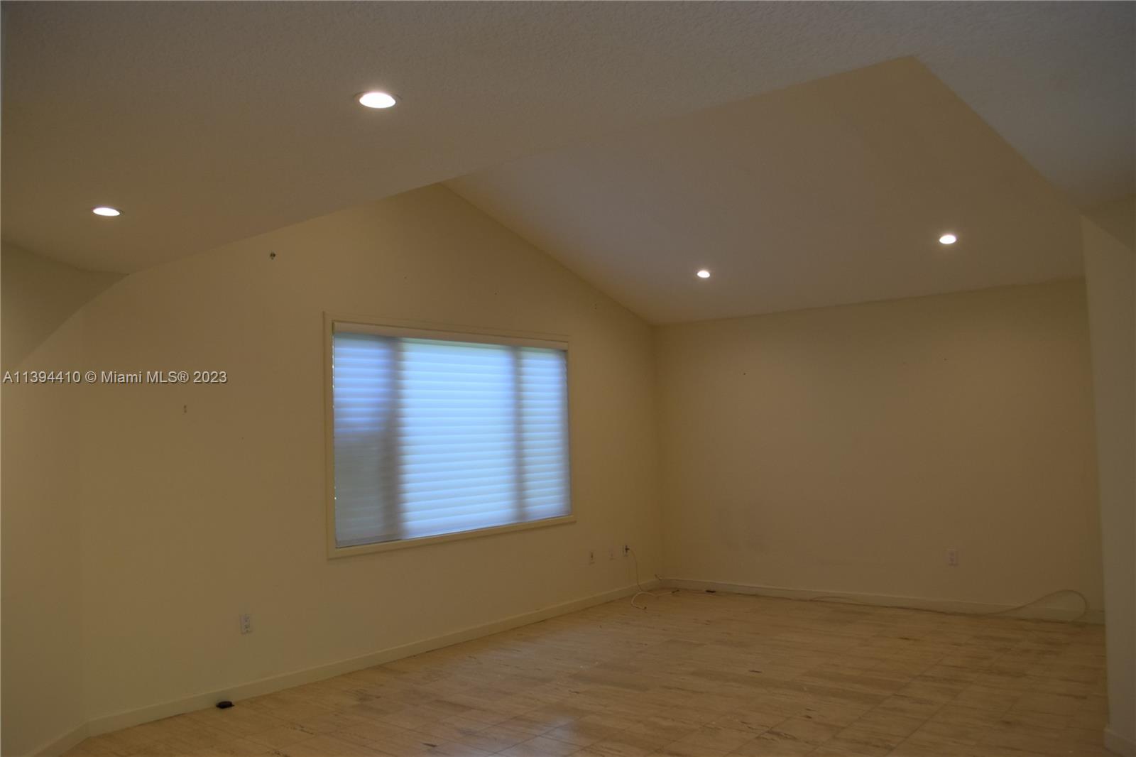 7115 Southwest 69th Court Miami, FL 33143 - Photo 52 of 58 a view of an empty room with a window