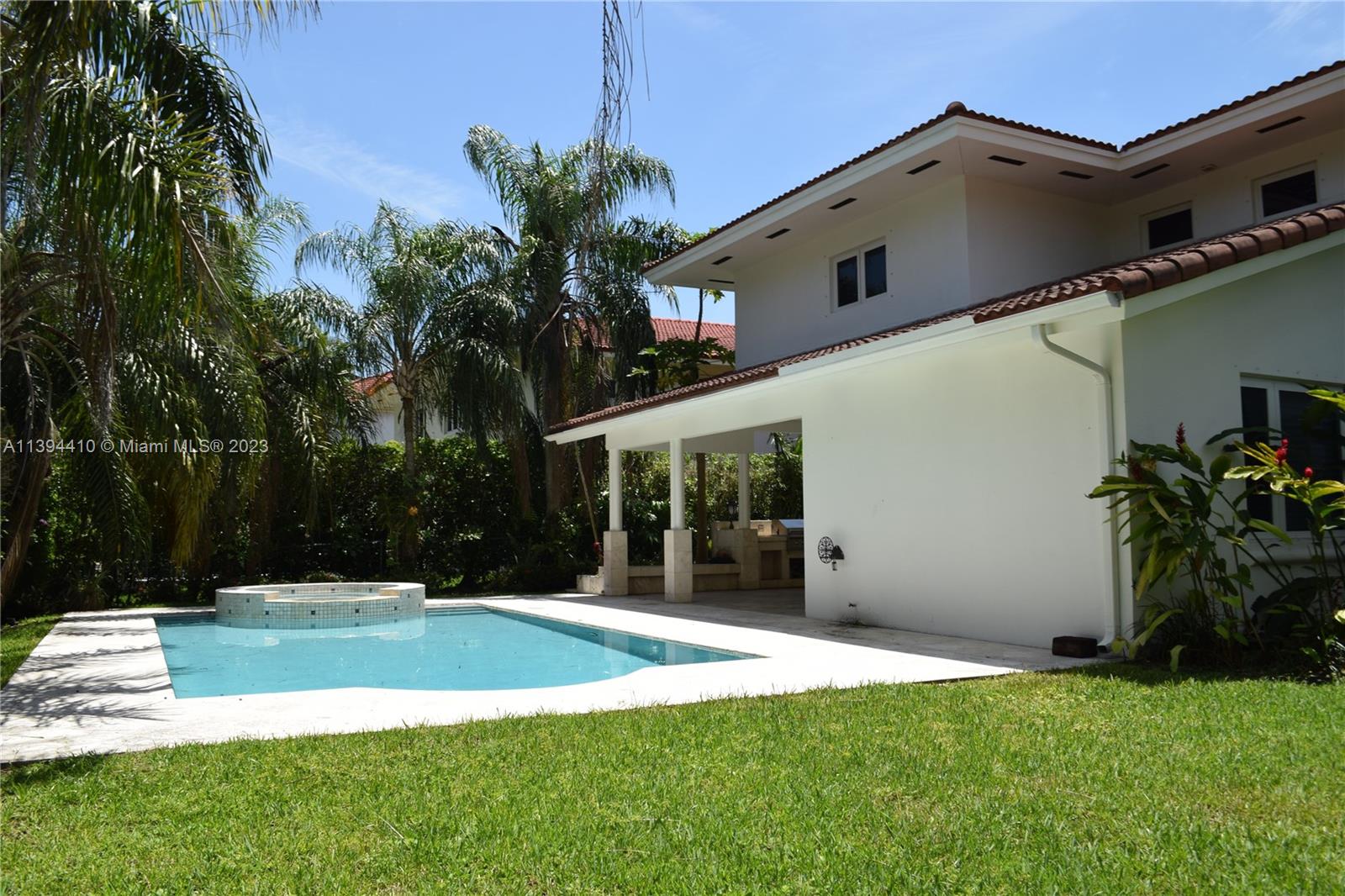7115 Southwest 69th Court Miami, FL 33143 - Photo 56 of 58 a view of a house with backyard and porch