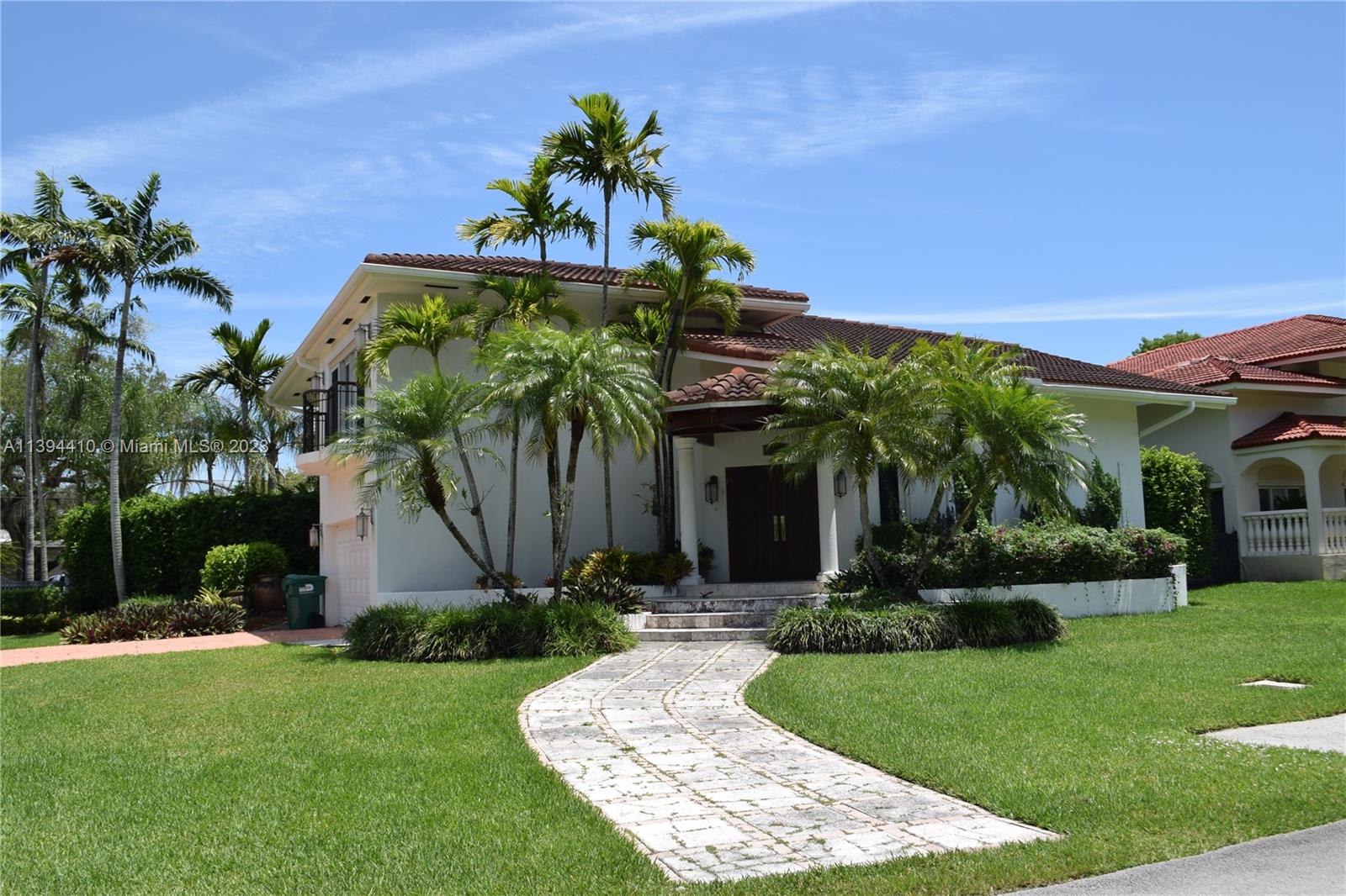 7115 Southwest 69th Court Miami, FL 33143 - Photo 58 of 58 a view of a house with a yard and potted plants