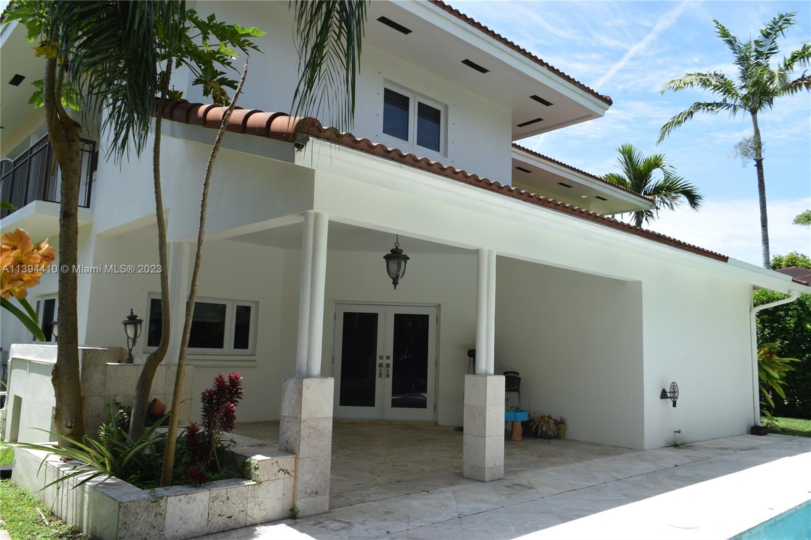 7115 Southwest 69th Court Miami, FL 33143 - Photo 8 of 58 a view of a house with a potted plant