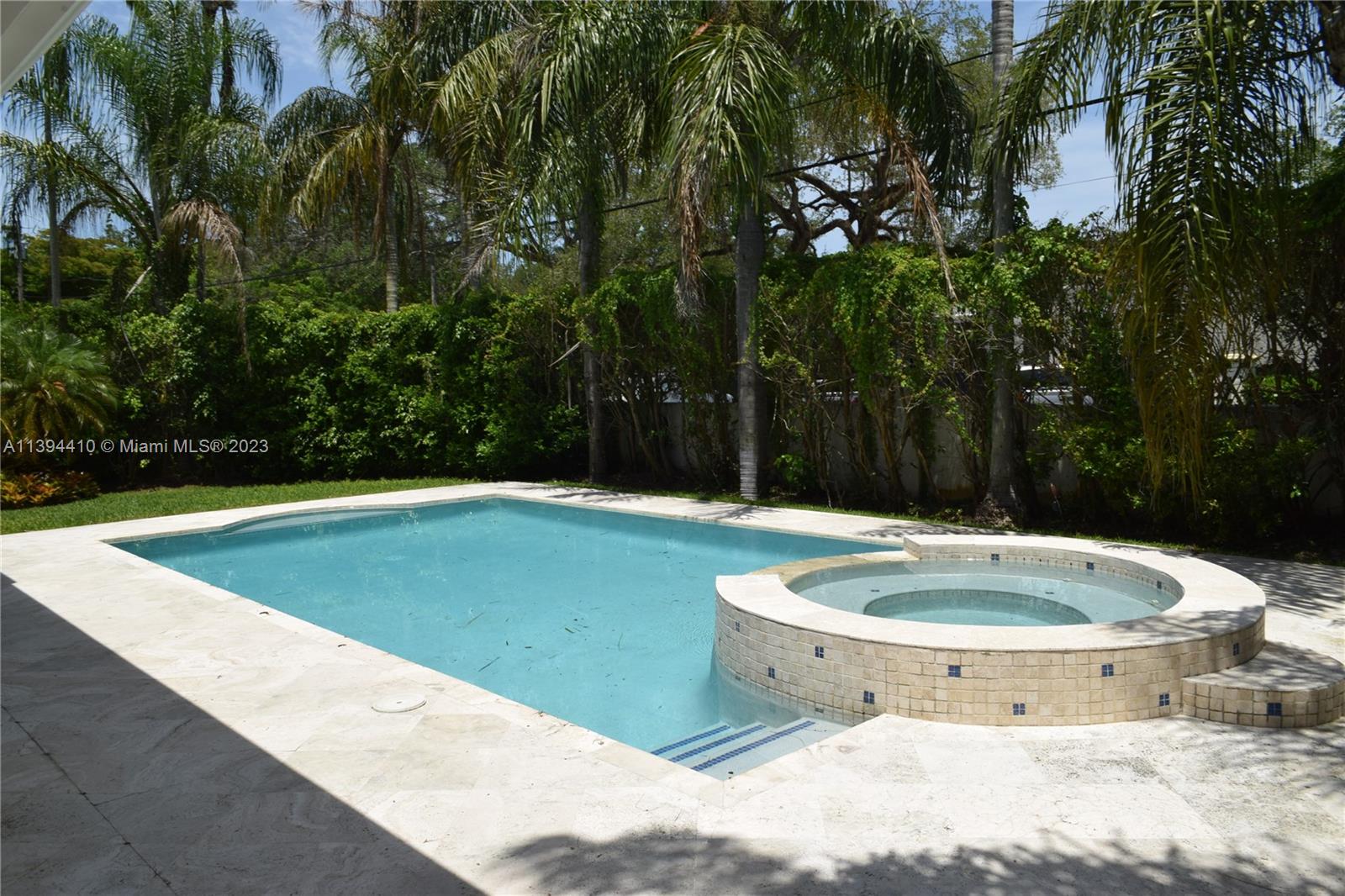 7115 Southwest 69th Court Miami, FL 33143 - Photo 9 of 58 a view of a swimming pool with a yard and trees