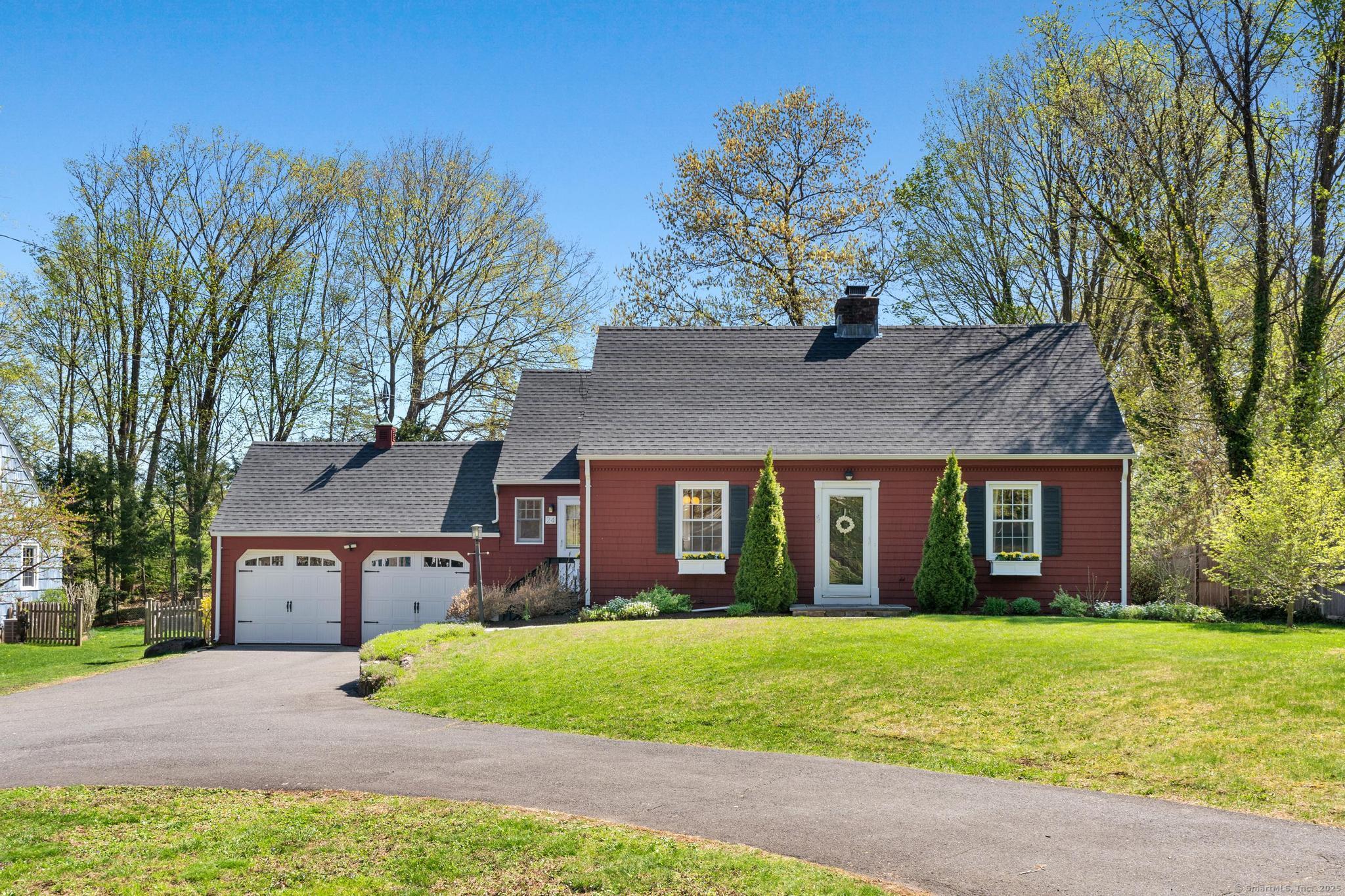 24 Woodruff Road West Hartford, CT 06107 - Photo 1 of 1 a front view of a house with garden