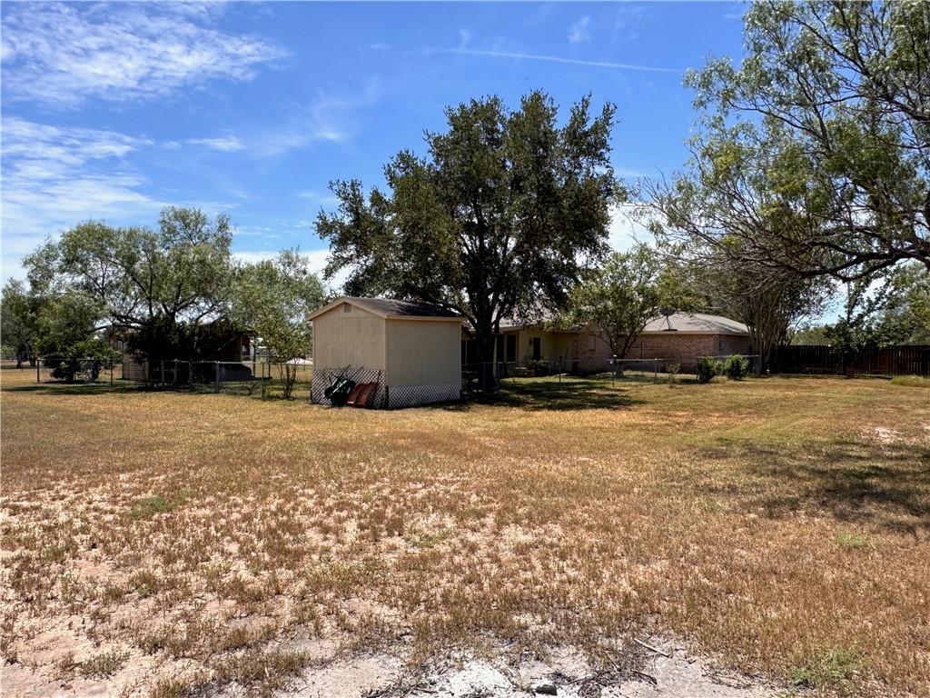 296 County Road 1601 Alice, TX 78332 - Photo 36 of 38 a street view with large trees