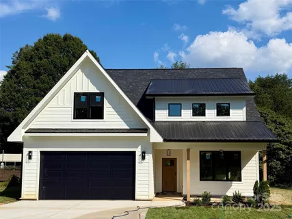 a view of house with yard