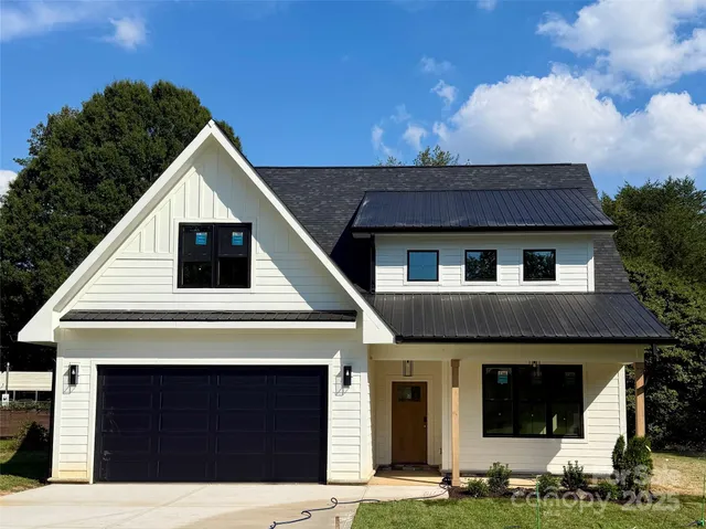 a view of house with yard
