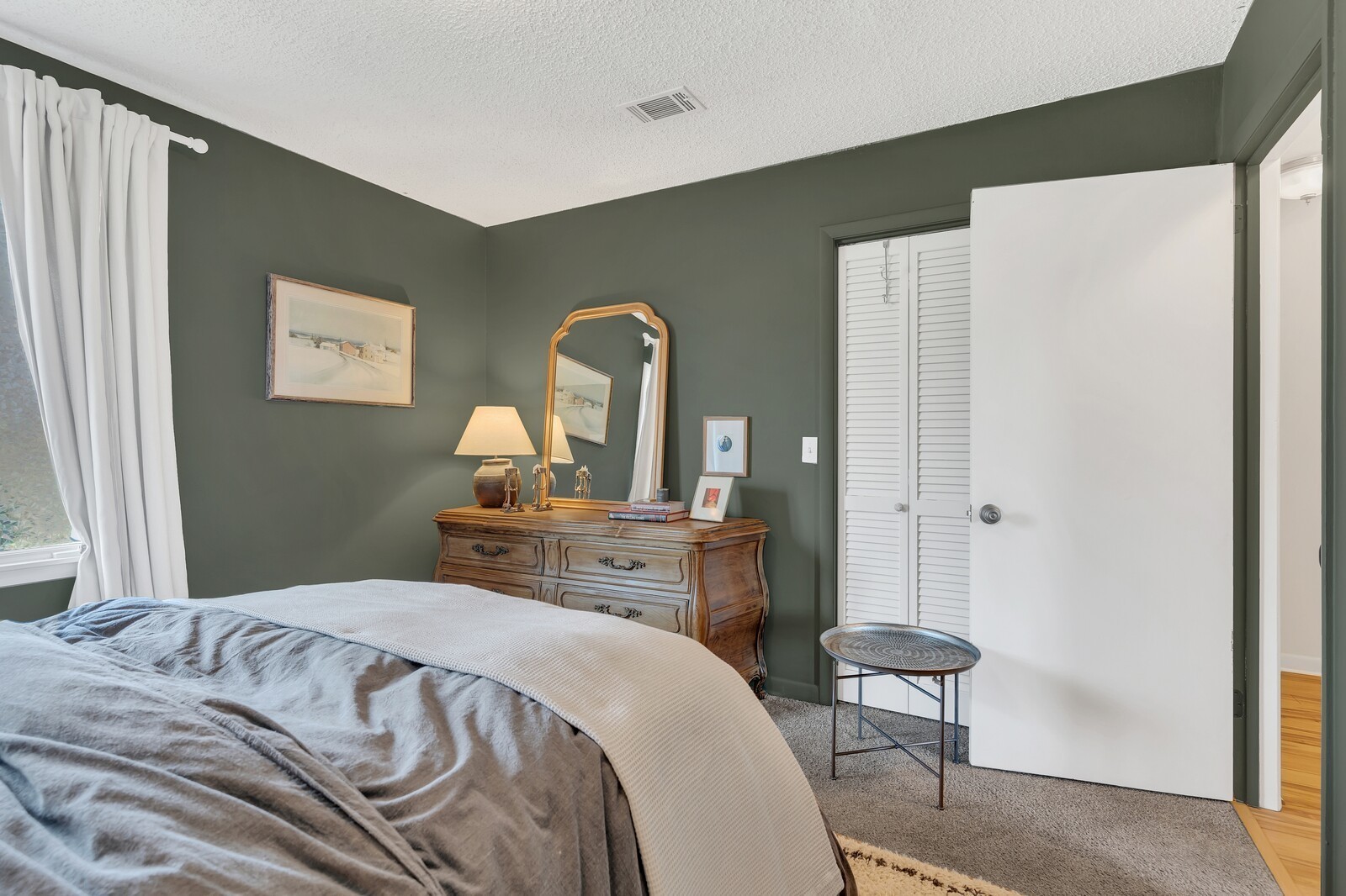 210 Raintree Drive Hermitage, TN 37076 - Photo 24 of 30 a bedroom with a bed and a dresser in it