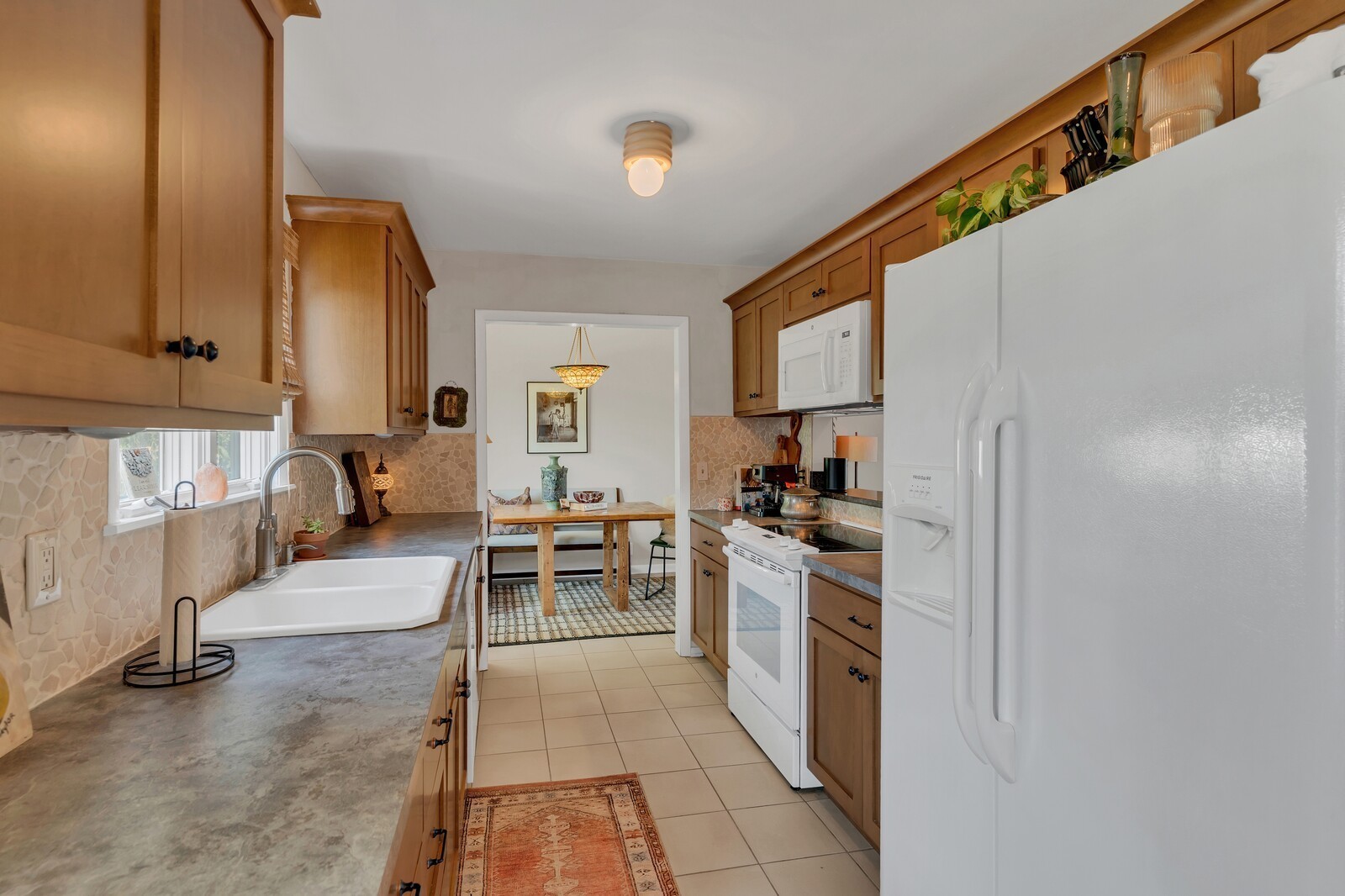 210 Raintree Drive Hermitage, TN 37076 - Photo 9 of 30 a kitchen with stainless steel appliances kitchen island granite countertop a sink and cabinets