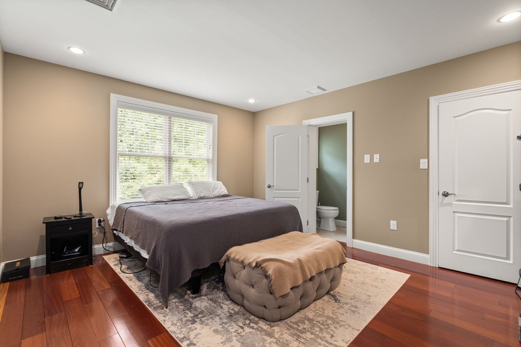 24 Wayside Inn Road Framingham, MA 01701 - Photo 29 of 38 a bedroom with a bed and a lamp